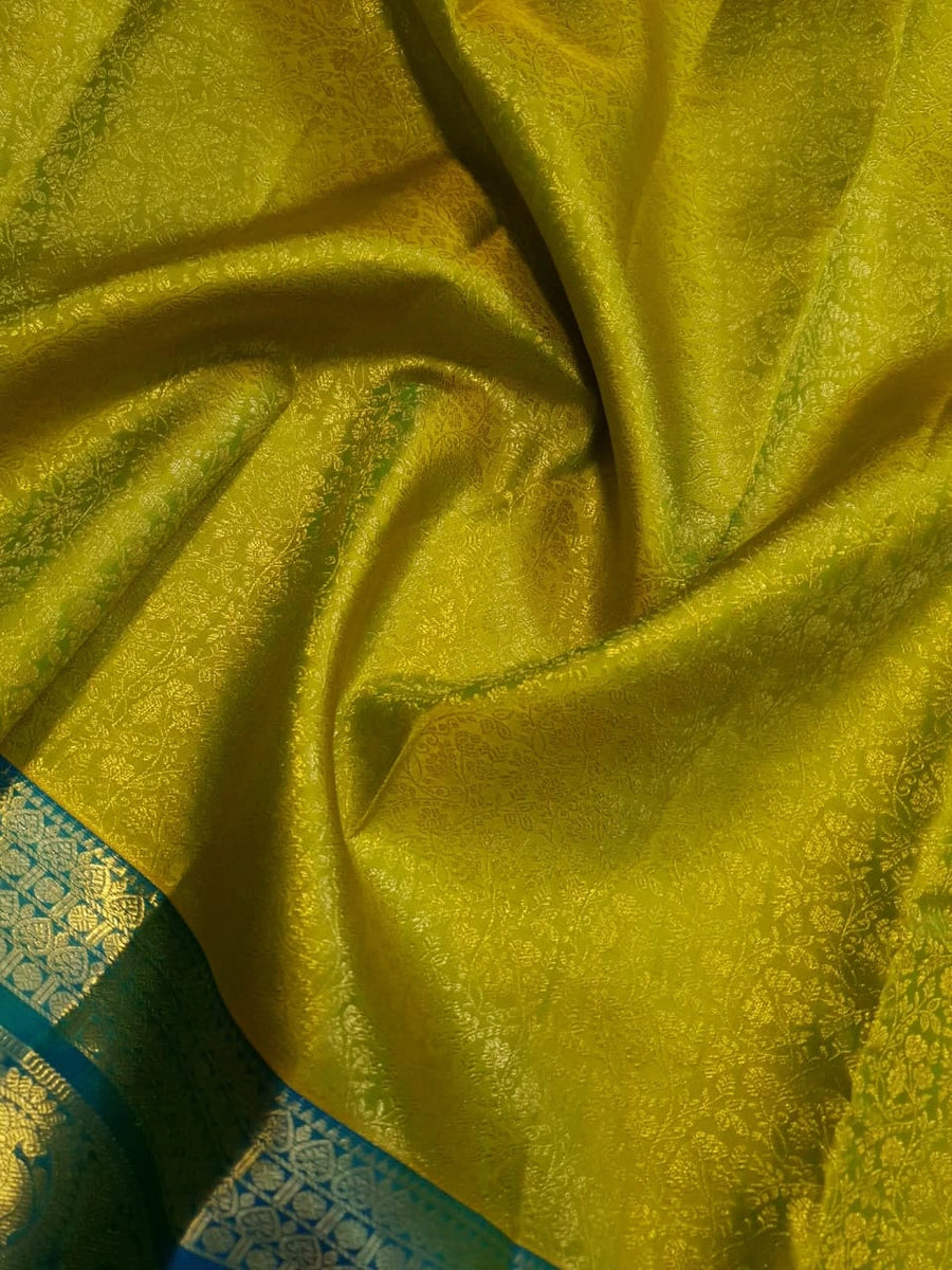 2G Pure Kanjivaram Silk Saree in Lime Green with Teal Blue Peacock Zari Border & Grand Gold Zari Pallu | Silkmark Certified