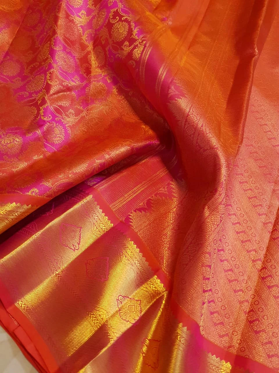 2G Pure Kanjivaram Silk Saree in Vibrant Orange with Pink Floral Brocade, Rich Gold Zari Border & Traditional Zari Pallu | Silkmark Certified