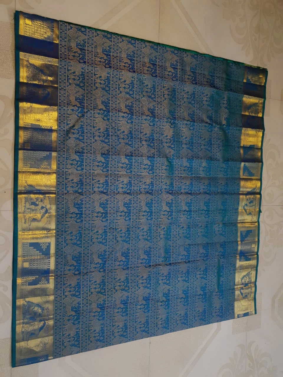 2G Pure Kanjivaram Silk Saree in Peacock Blue with Antique Gold Temple Border, Traditional Horse Butta & Traditional Motif Design | Silkmark Certified