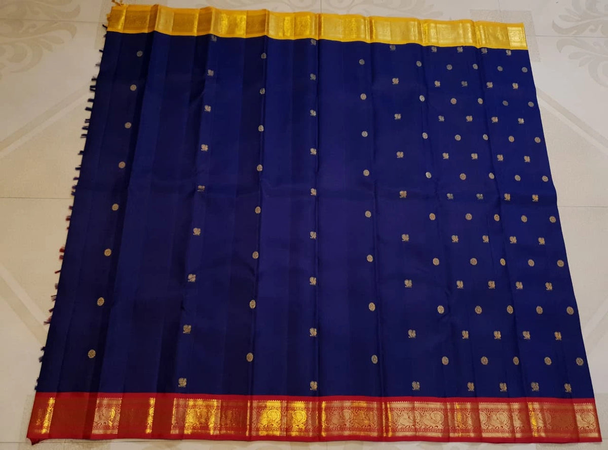 3G Pure Zari Ganga Jamuna Kanjivaram Silk Saree in Navy Blue with Gold Peacock Buttas & Red and Yellow Peacock Border | Silkmark Certified