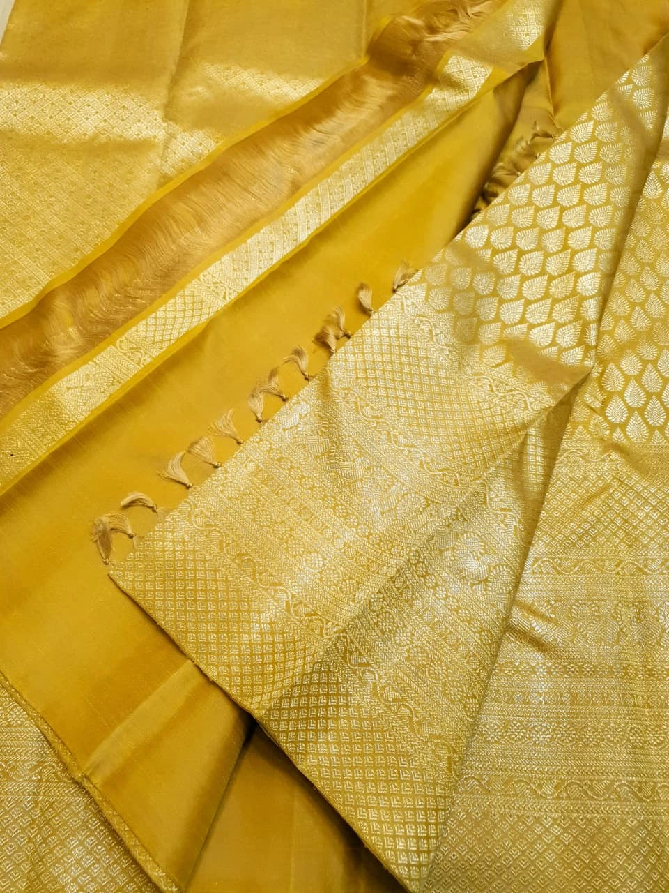2G Pure Kanjivaram Silk Saree in Golden Yellow with Full-Body Leaf Motifs & Rich Gold Zari Peacock Border | Silkmark Certified