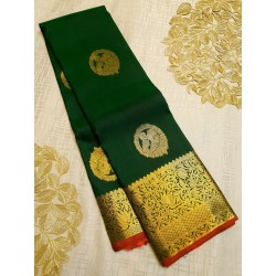 Green kanjivaram silks saree with Chilli Red pallu and Blouse
