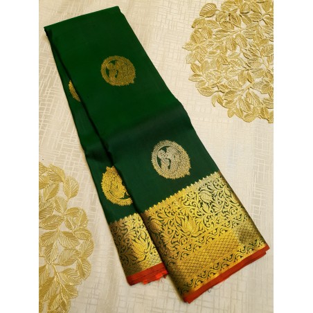 Green kanjivaram silks saree with Chilli Red pallu and Blouse