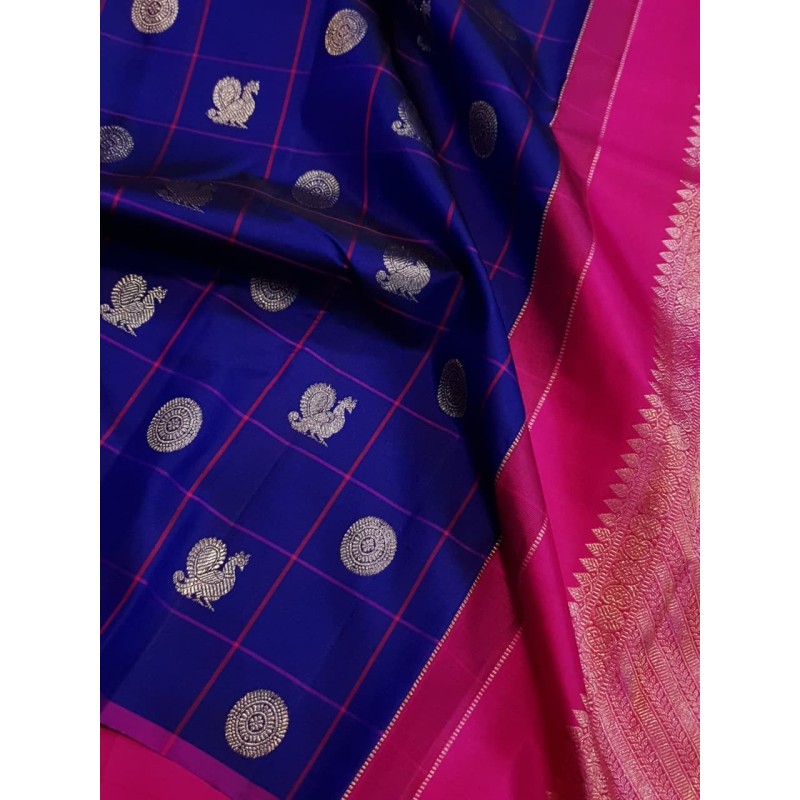 Royal Blue Borderless Kanchivaram with Mayil Chakram Buttas and Rani Pink Silver Zari Pallu