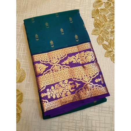 Peacock blue designer silk saree with dark navy Body motifs