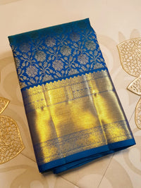 2G Kanjivaram Silk Saree in Peacock Blue with Rich Gold Zari Floral Brocade & Traditional Broad Border | Silkmark Certified
