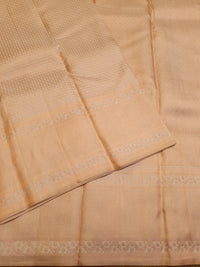 2G Pure Kanjivaram Silk Saree in Cream with All-Over Zari Buttas & Rich Copper Zari Border | Silkmark Certified