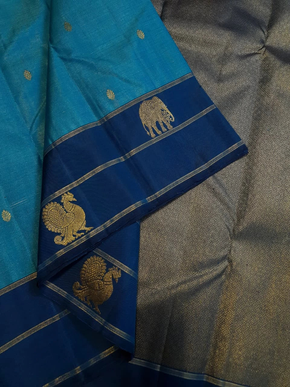 2G Pure Kanjivaram Silk Saree in Turquoise Blue with Navy Blue Elephant Zari Border & Small Zari Buttas | Silkmark Certified