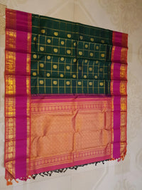 2G Kanjivaram Silk Saree in Deep Bottle Green with Magenta Contrast Border & Peacock Butta | Silkmark Certified