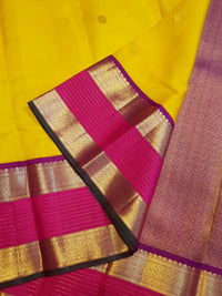 2G Pure Kanjivaram Silk Saree in Bright Yellow with Magenta Broad Zari Border & Grand Zari Pallu | Silkmark Certified