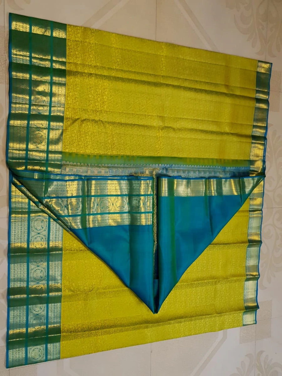 2G Pure Kanjivaram Silk Saree in Lime Green with Teal Blue Peacock Zari Border & Grand Gold Zari Pallu | Silkmark Certified