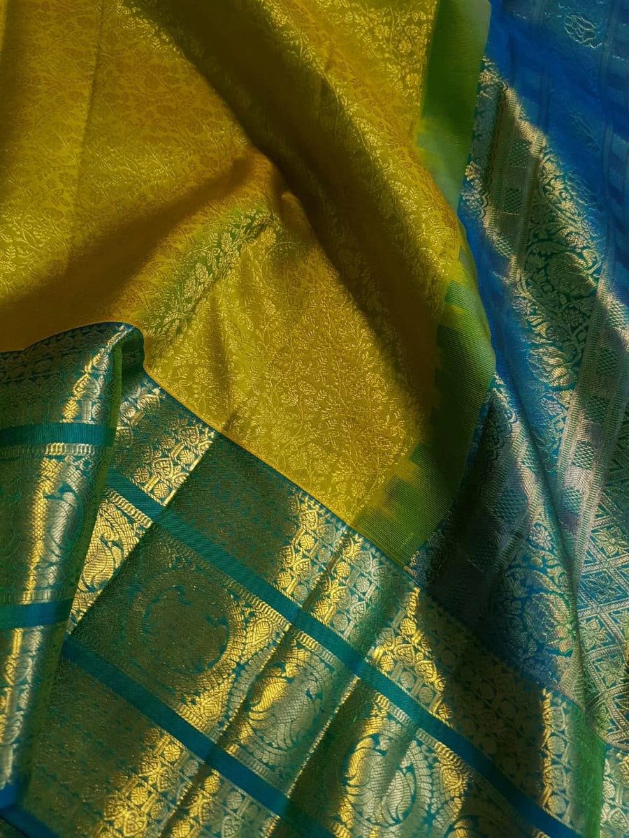 2G Pure Kanjivaram Silk Saree in Lime Green with Teal Blue Peacock Zari Border & Grand Gold Zari Pallu | Silkmark Certified