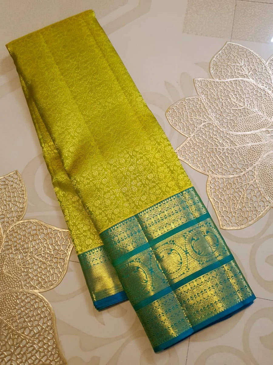 2G Pure Kanjivaram Silk Saree in Lime Green with Teal Blue Peacock Zari Border & Grand Gold Zari Pallu | Silkmark Certified