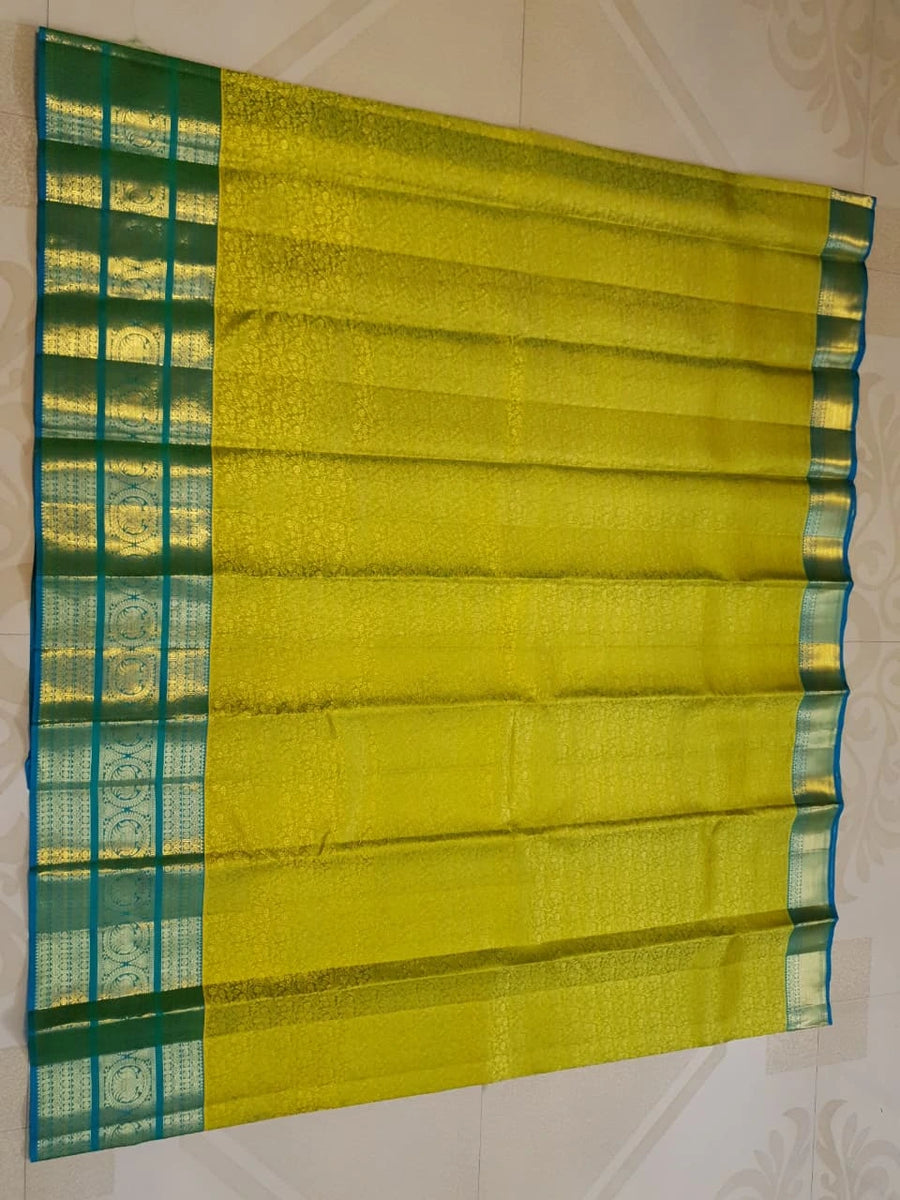2G Pure Kanjivaram Silk Saree in Lime Green with Teal Blue Peacock Zari Border & Grand Gold Zari Pallu | Silkmark Certified