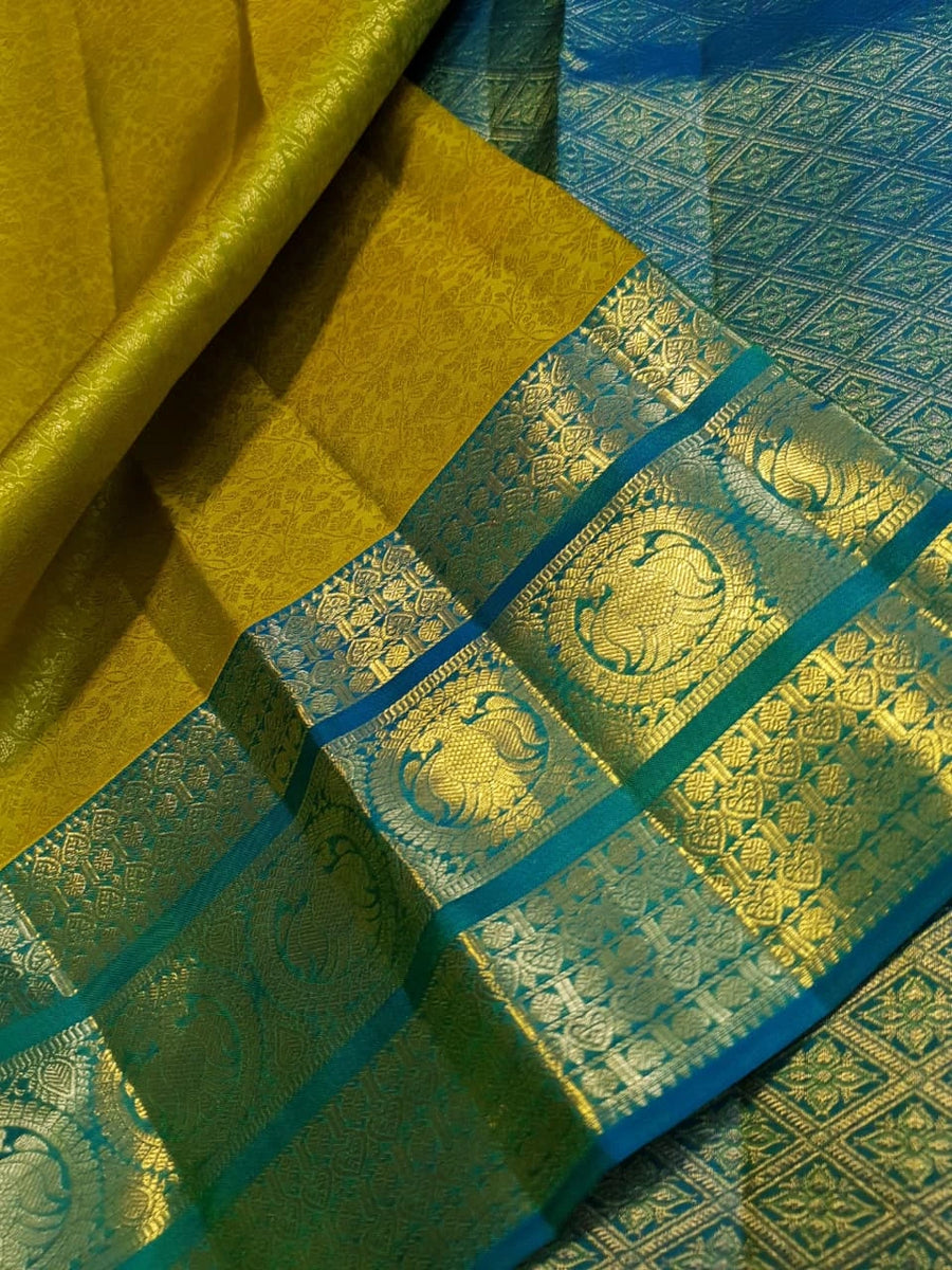 2G Pure Kanjivaram Silk Saree in Lime Green with Teal Blue Peacock Zari Border & Grand Gold Zari Pallu | Silkmark Certified