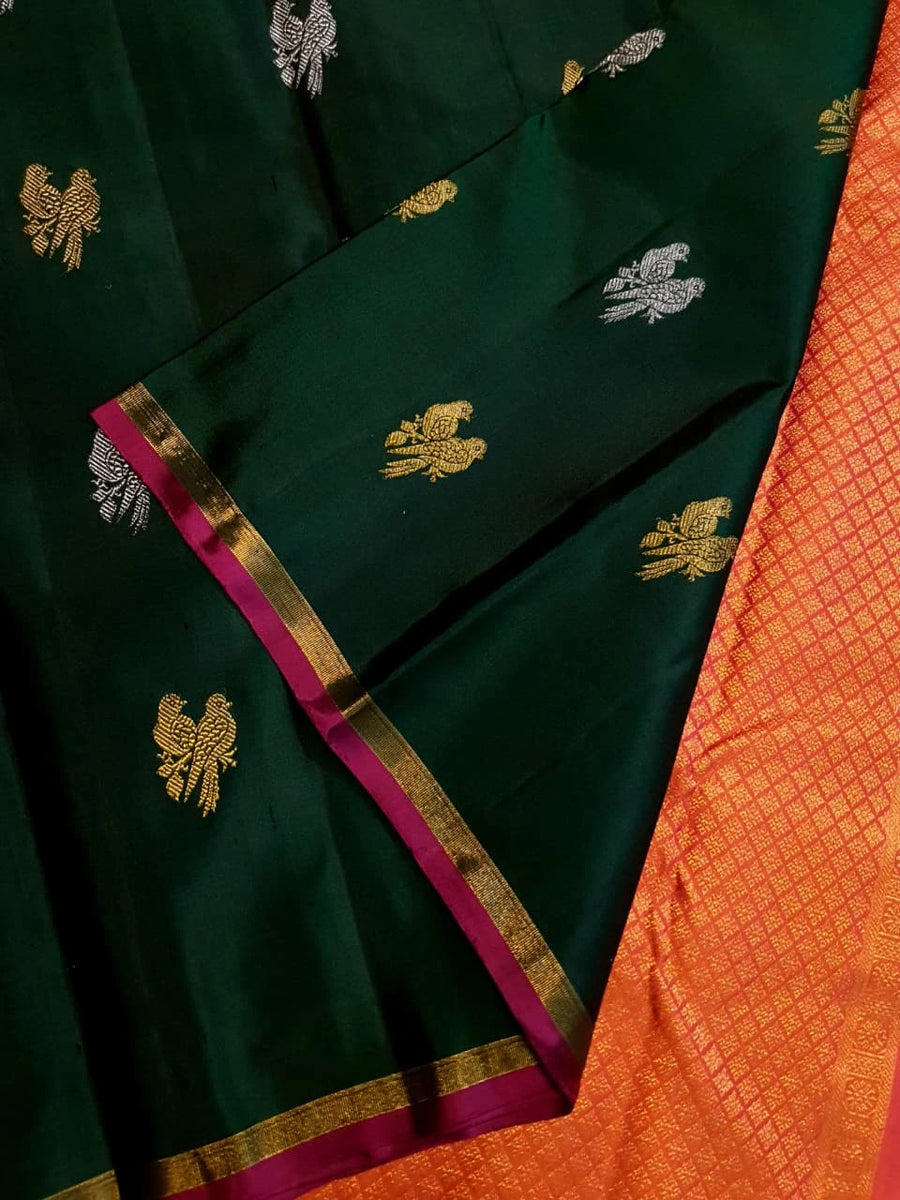 2G Pure Kanjivaram Silk Saree in Deep Bottle Green with Magenta Gold Zari Border & Coral Orange Parrot Butta Pallu | Silkmark Certified