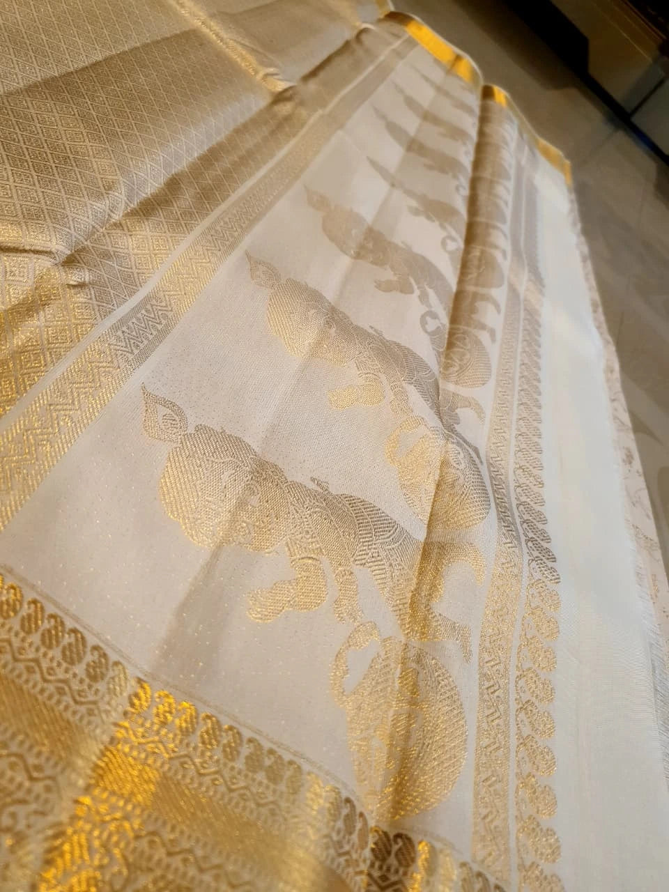 2 Gram Pure Kanjivaram Silk Saree in Cream with Rich Gold Zari Floral Motifs, Broad Zari Border & Traditional Lord Krishna Pallu | Silkmark Certified