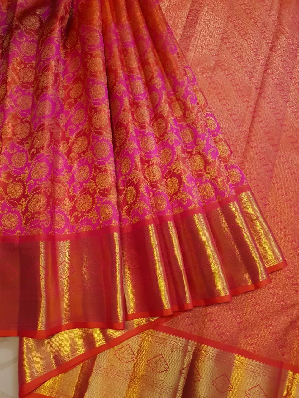 2G Pure Kanjivaram Silk Saree in Vibrant Orange with Pink Floral Brocade, Rich Gold Zari Border & Traditional Zari Pallu | Silkmark Certified