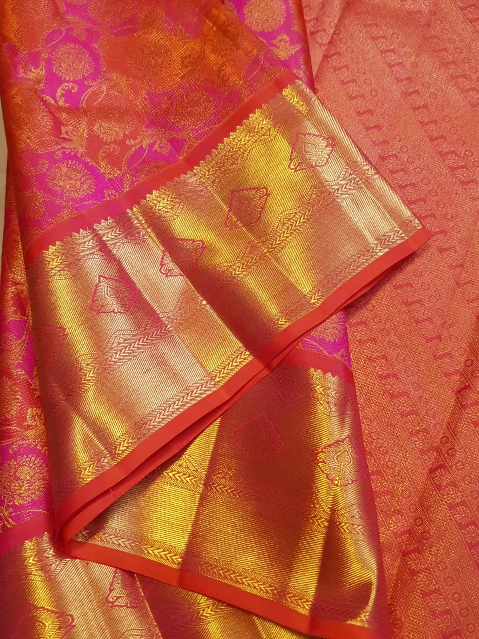 2G Pure Kanjivaram Silk Saree in Vibrant Orange with Pink Floral Brocade, Rich Gold Zari Border & Traditional Zari Pallu | Silkmark Certified