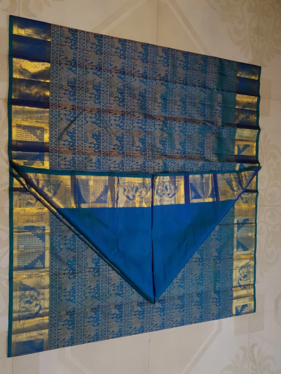 2G Pure Kanjivaram Silk Saree in Peacock Blue with Antique Gold Temple Border, Traditional Horse Butta & Traditional Motif Design | Silkmark Certified