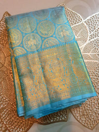 2G Pure Kanjivaram Silk Saree in Sky Blue with Gold Zari Peacock Butta & Rich Zari Border | Silkmark Certified