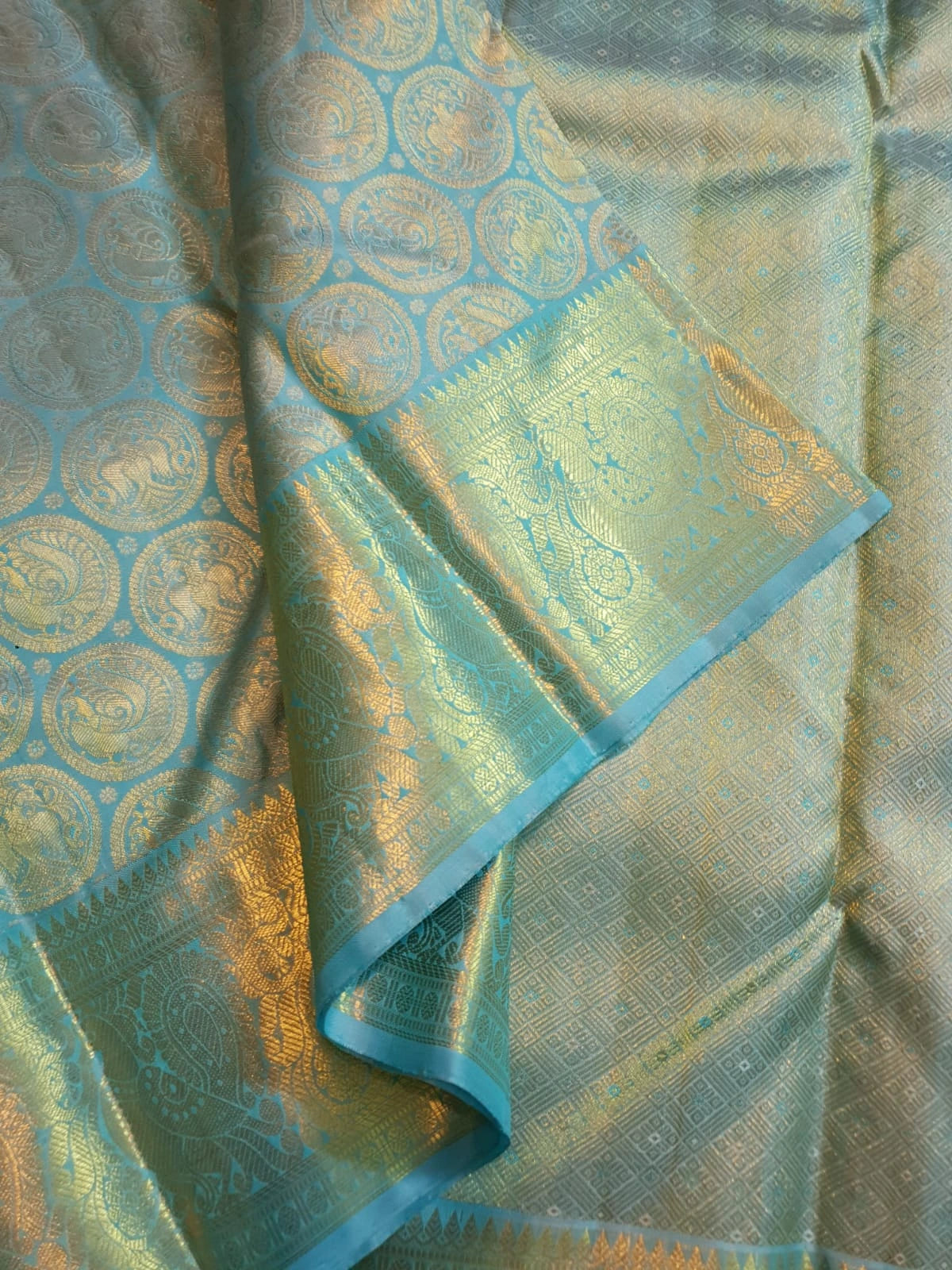 2G Pure Kanjivaram Silk Saree in Sky Blue with Gold Zari Peacock Butta & Rich Zari Border | Silkmark Certified