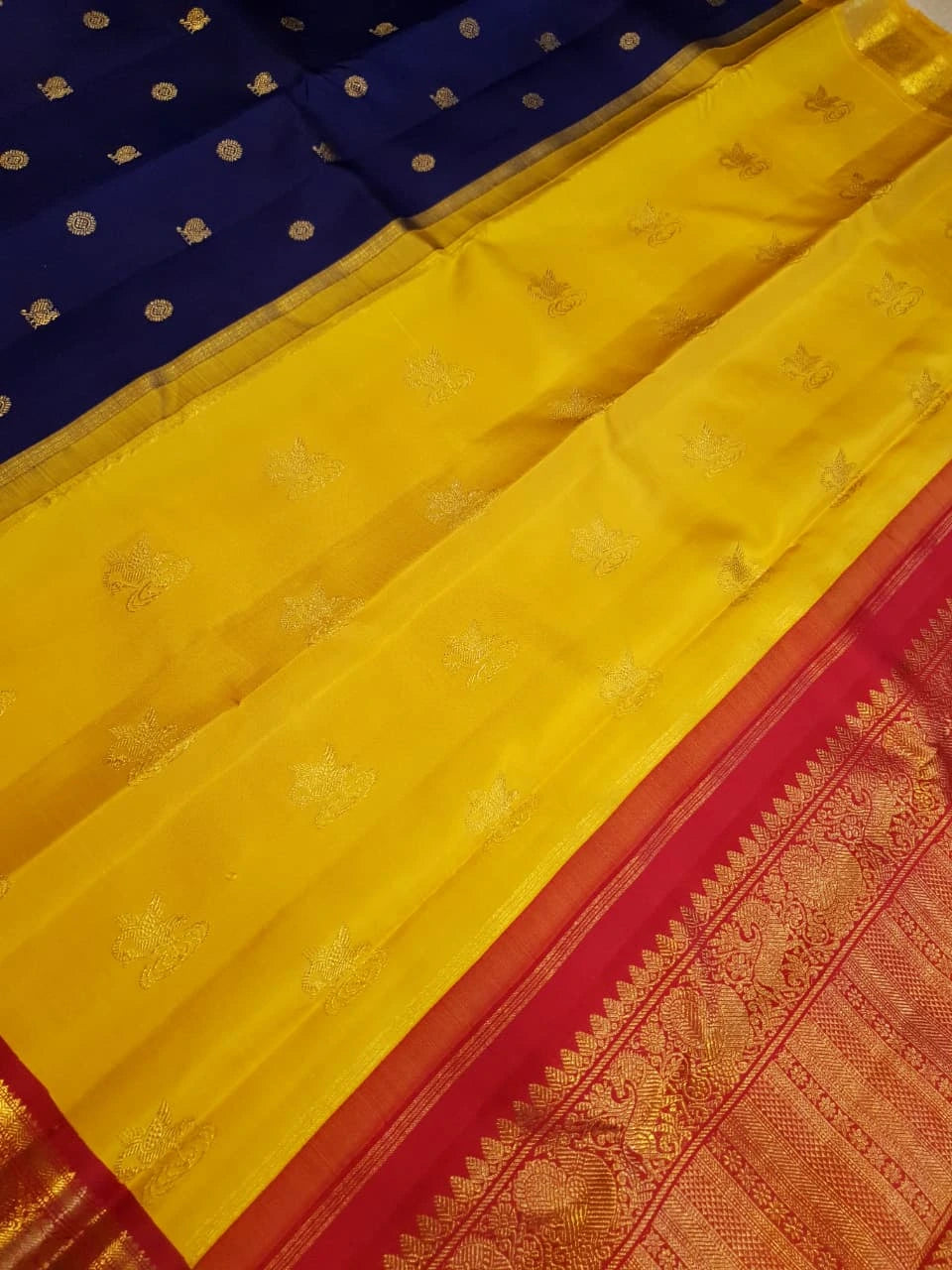 3G Pure Zari Ganga Jamuna Kanjivaram Silk Saree in Navy Blue with Gold Peacock Buttas & Red and Yellow Peacock Border | Silkmark Certified