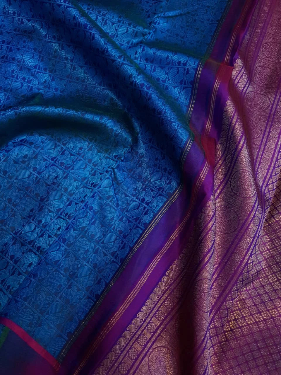 3G Pure Zari Kanjivaram Silk Saree in Ananda Blue with Traditional Elephant & Peacock Zari Motifs and Purple Border | Silkmark Certified